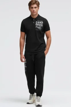 Kurzarmpolo aus Pikee mit Artworks black | M