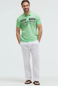 Kurzarmpolo Oil Dyed mit Logo Print neon green