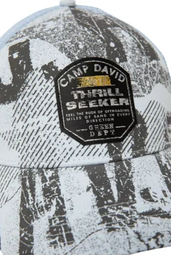 Trucker Cap mit All Over Print und Patch silver blue