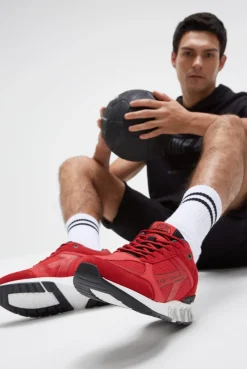 Urban Sneaker im Materialmix mit Logo-Sohle energy red